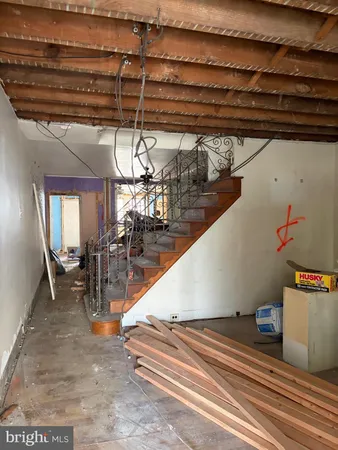 a view of kitchen with a stove wooden floor and window