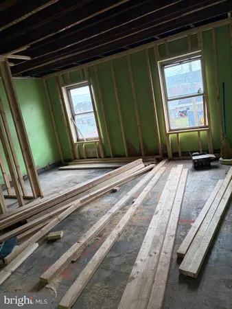 a view of a room with wooden walls