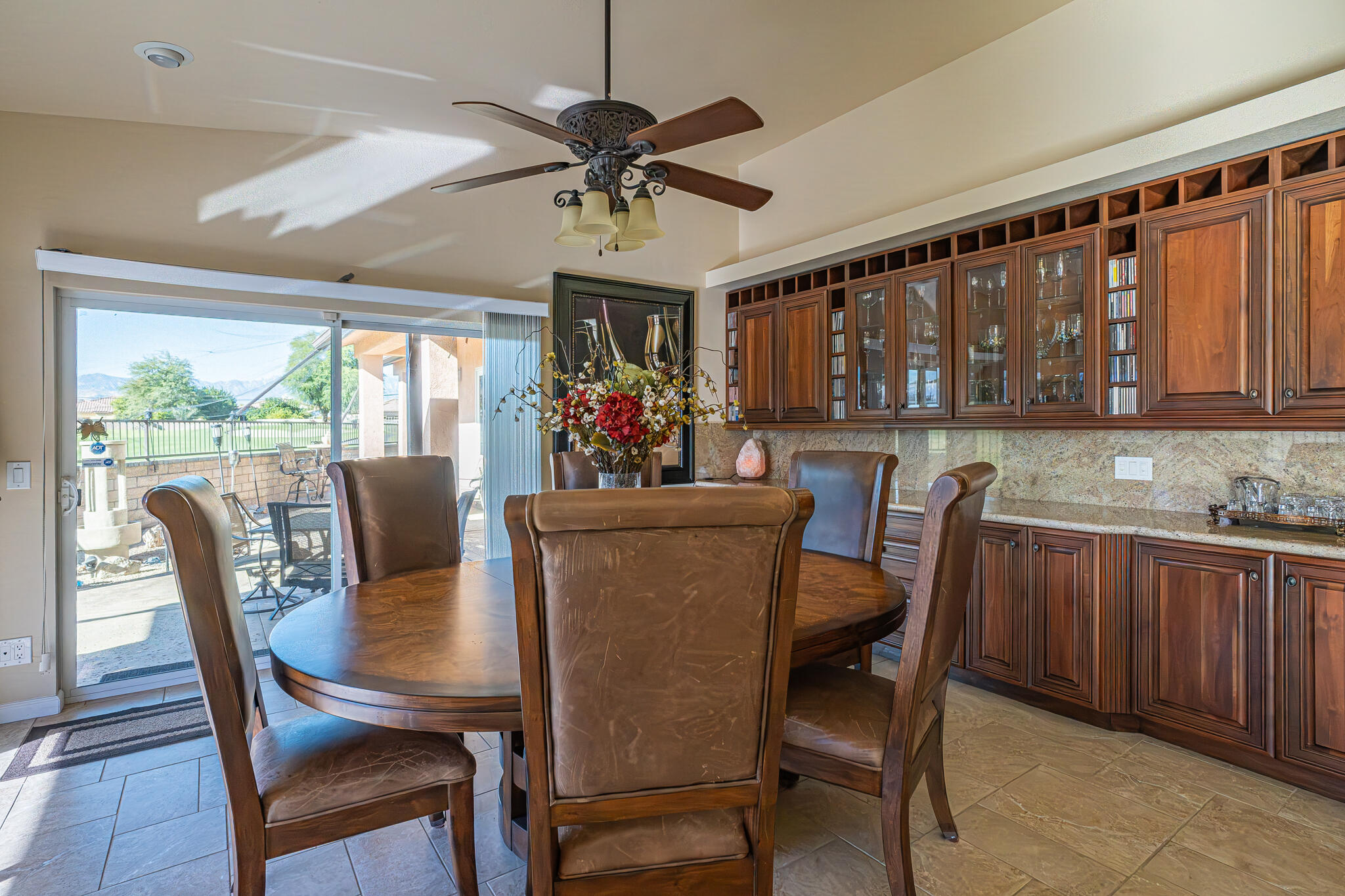 79815 Horseshoe Road La Quinta, CA 92253 - Photo 11 of 33 a view of a dining room with furniture window and wooden floor