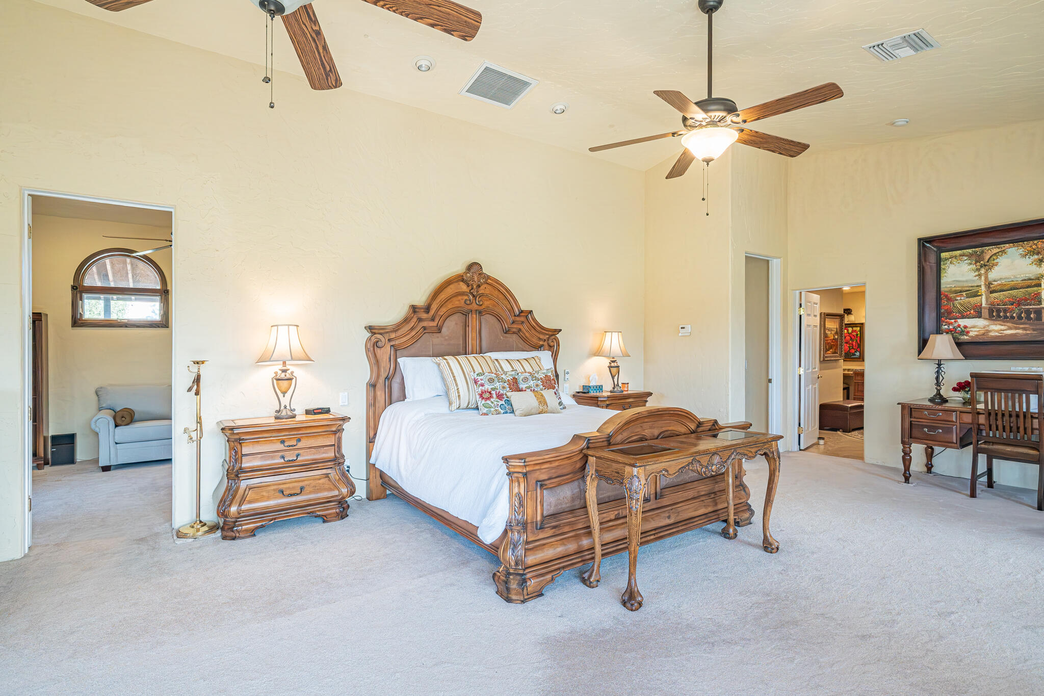 79815 Horseshoe Road La Quinta, CA 92253 - Photo 14 of 33 a bedroom with a bed and a chandelier