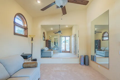 a spacious bathroom with double vanity and a mirror