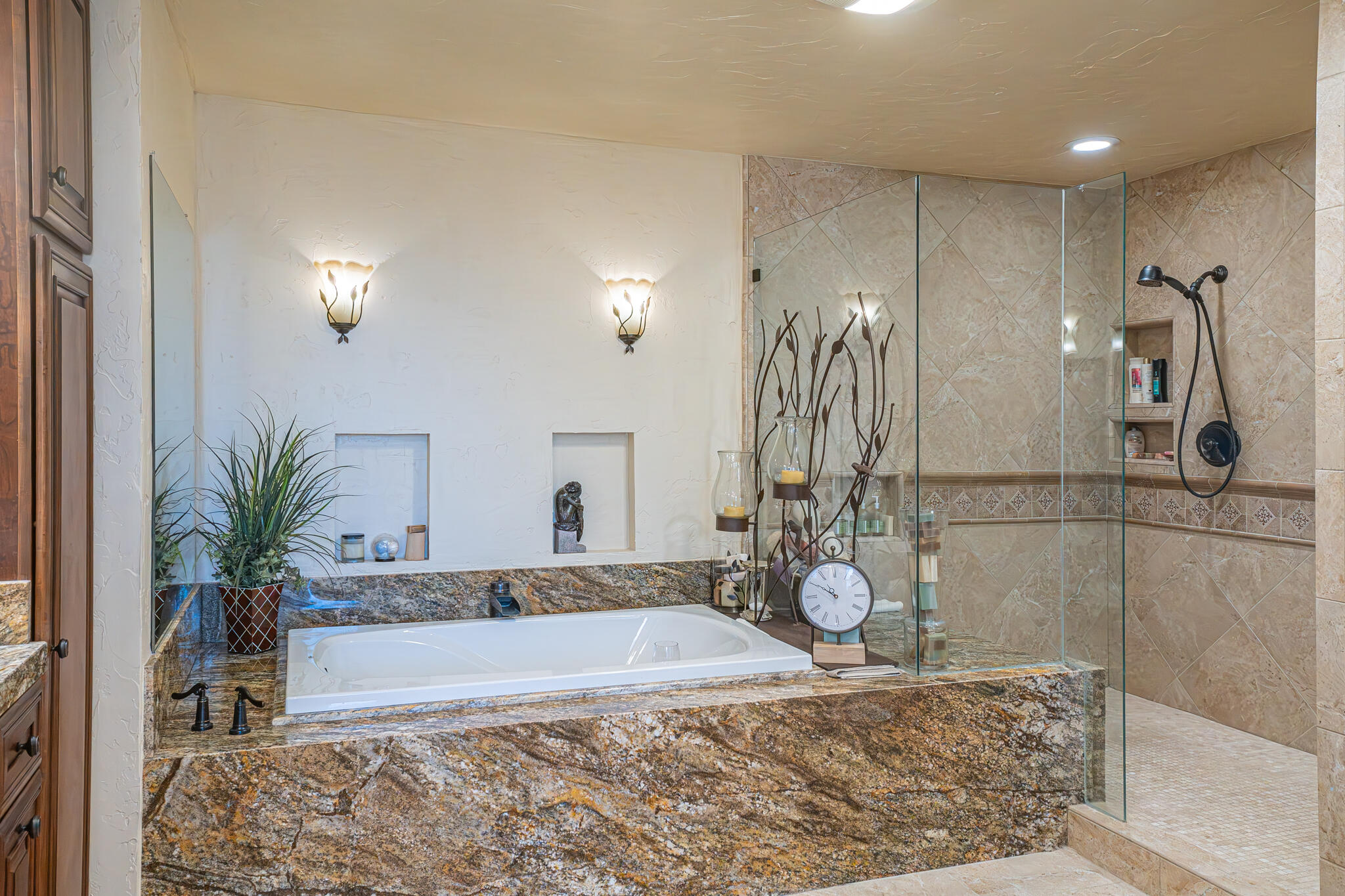 79815 Horseshoe Road La Quinta, CA 92253 - Photo 19 of 33 a bathroom with a granite countertop sink a toilet and shower