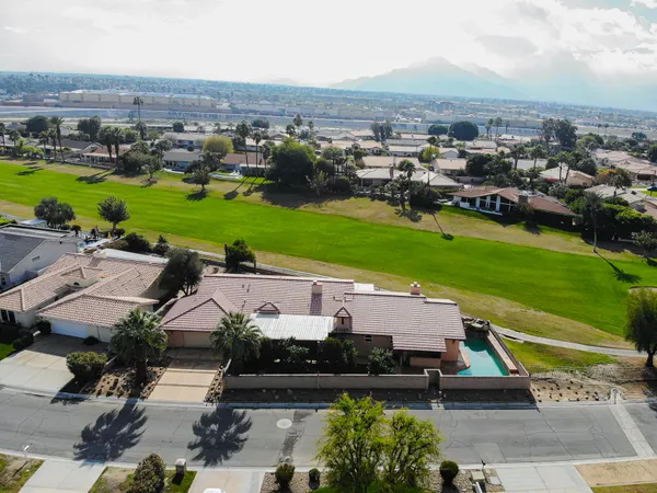 an aerial view of a house with a garden