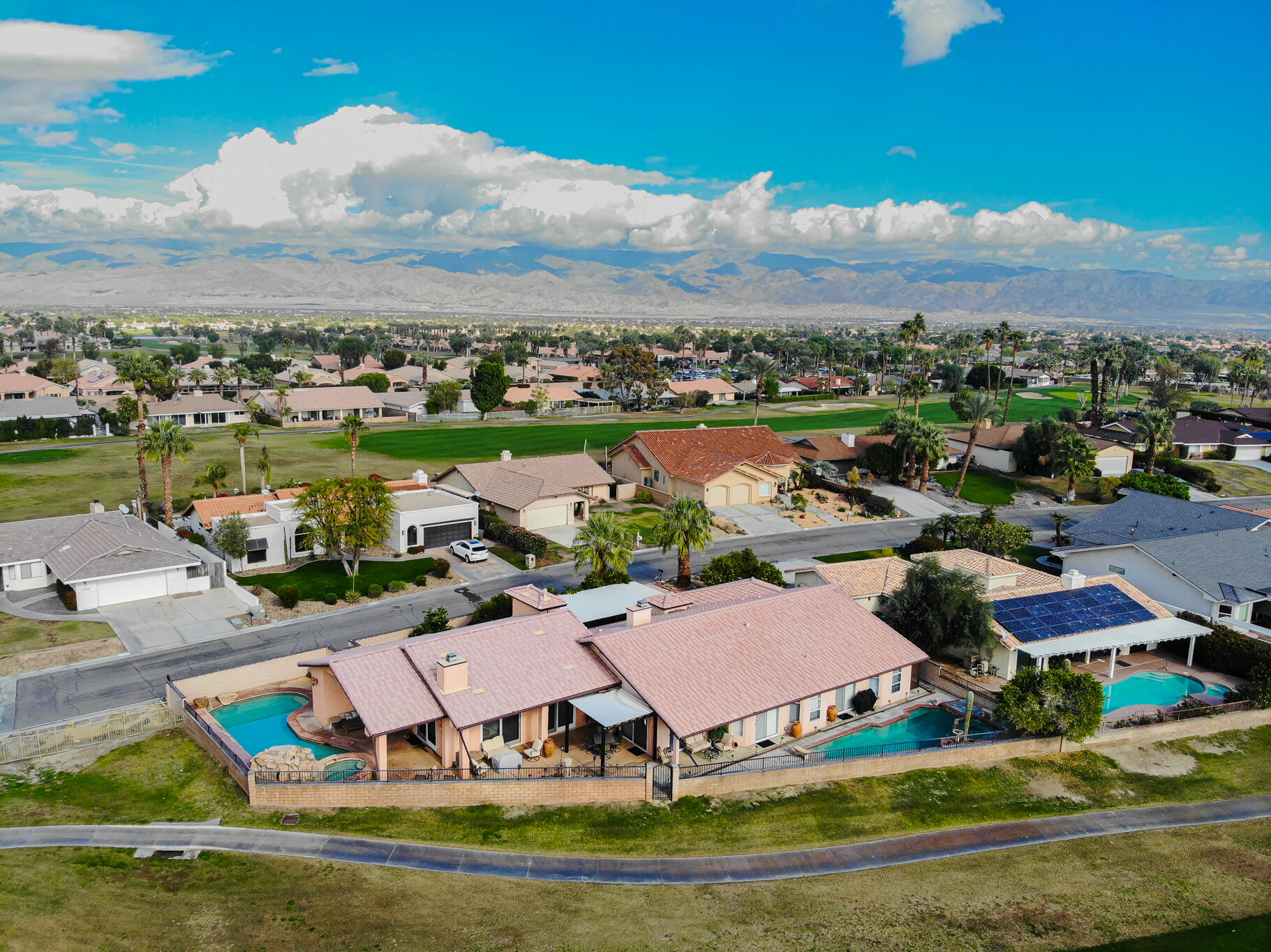 79815 Horseshoe Road La Quinta, CA 92253 - Photo 31 of 33 an aerial view of residential houses with outdoor space and ocean view
