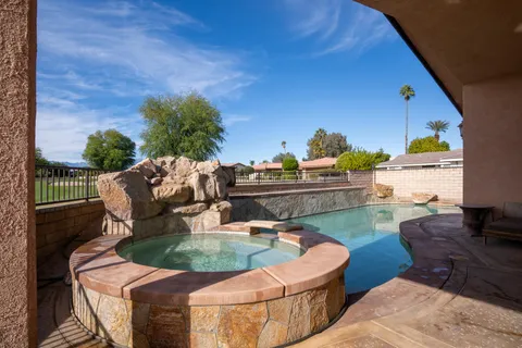 a view of a backyard with sitting area
