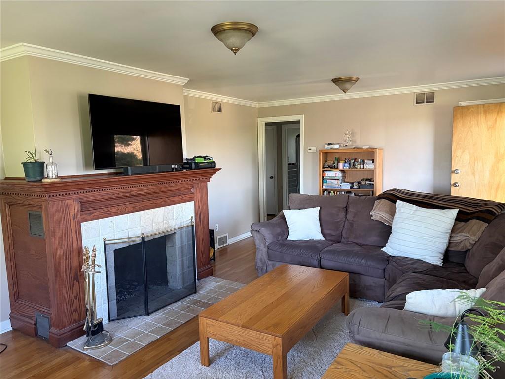 359 Dorseyville Road Pittsburgh, PA 15215 - Photo 3 of 29 a living room with furniture and a fireplace