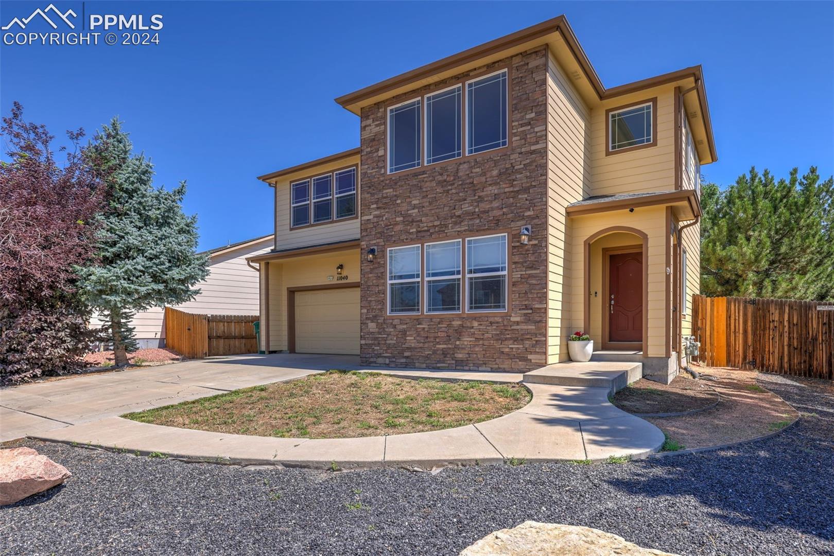11040 Falling Star Road Fountain, CO 80817 - Photo 1 of 50 View of front of home featuring a garage