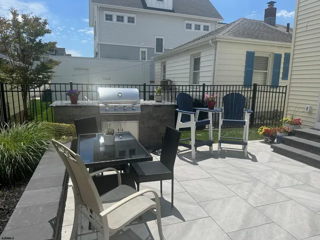 a view of a chairs and table in a patio