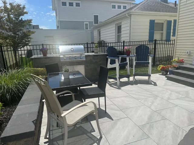 a view of a chairs and table in backyard of the house