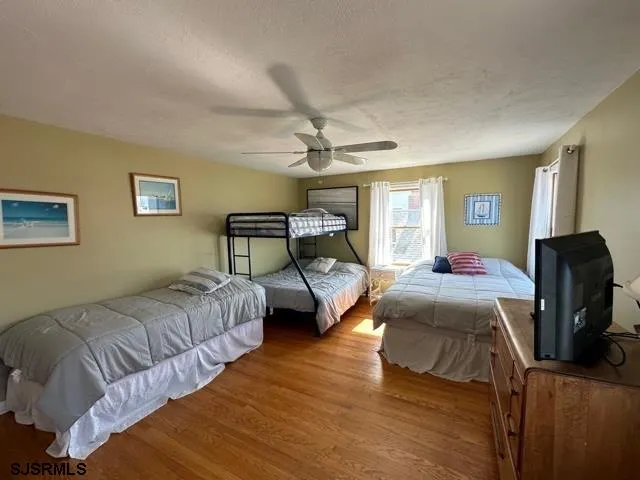 a bedroom with bed and window