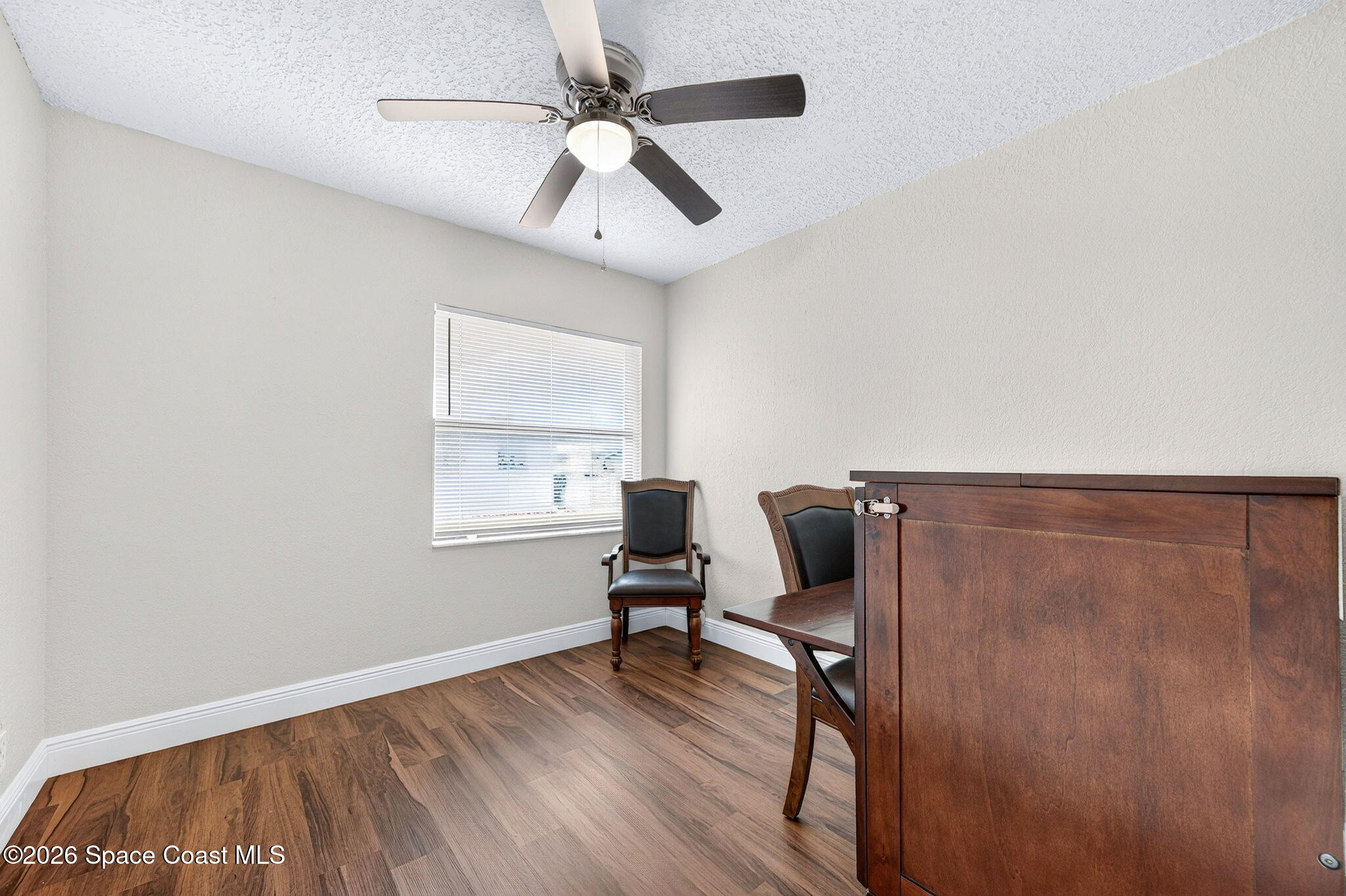 996 Botany Lane Rockledge, FL 32955 - Photo 25 of 35 a view of workspace with wooden floor and windows