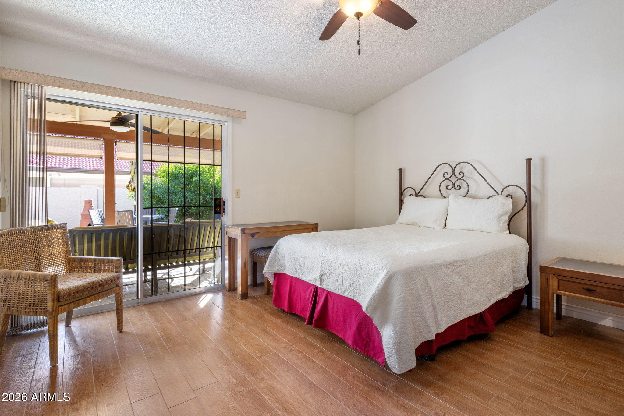 542 South Higley Road, Unit 54 Mesa, AZ 85206 - Photo 12 of 29 a bedroom with a large bed and a chandelier