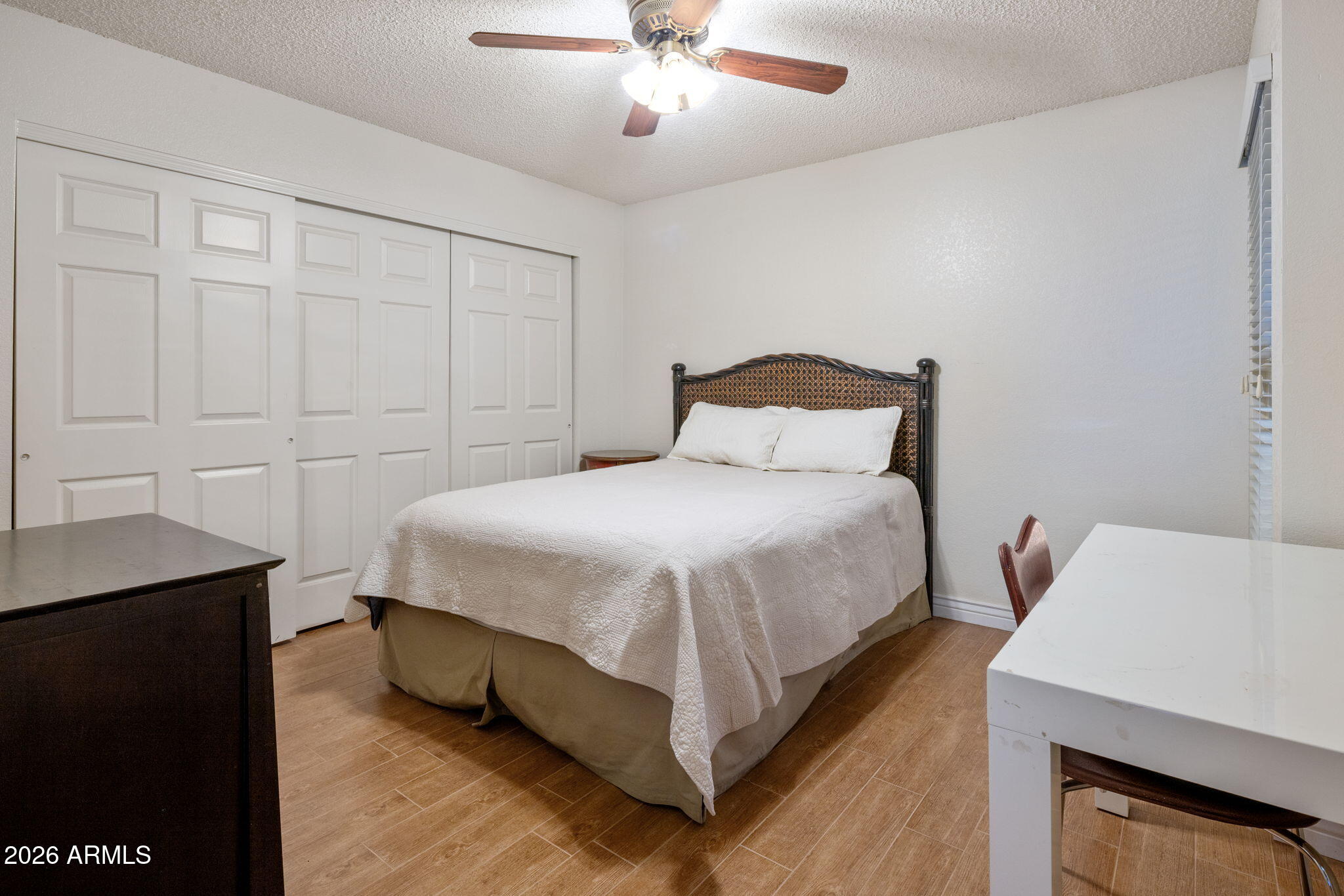 542 South Higley Road, Unit 54 Mesa, AZ 85206 - Photo 14 of 29 a bedroom with a bed and a table