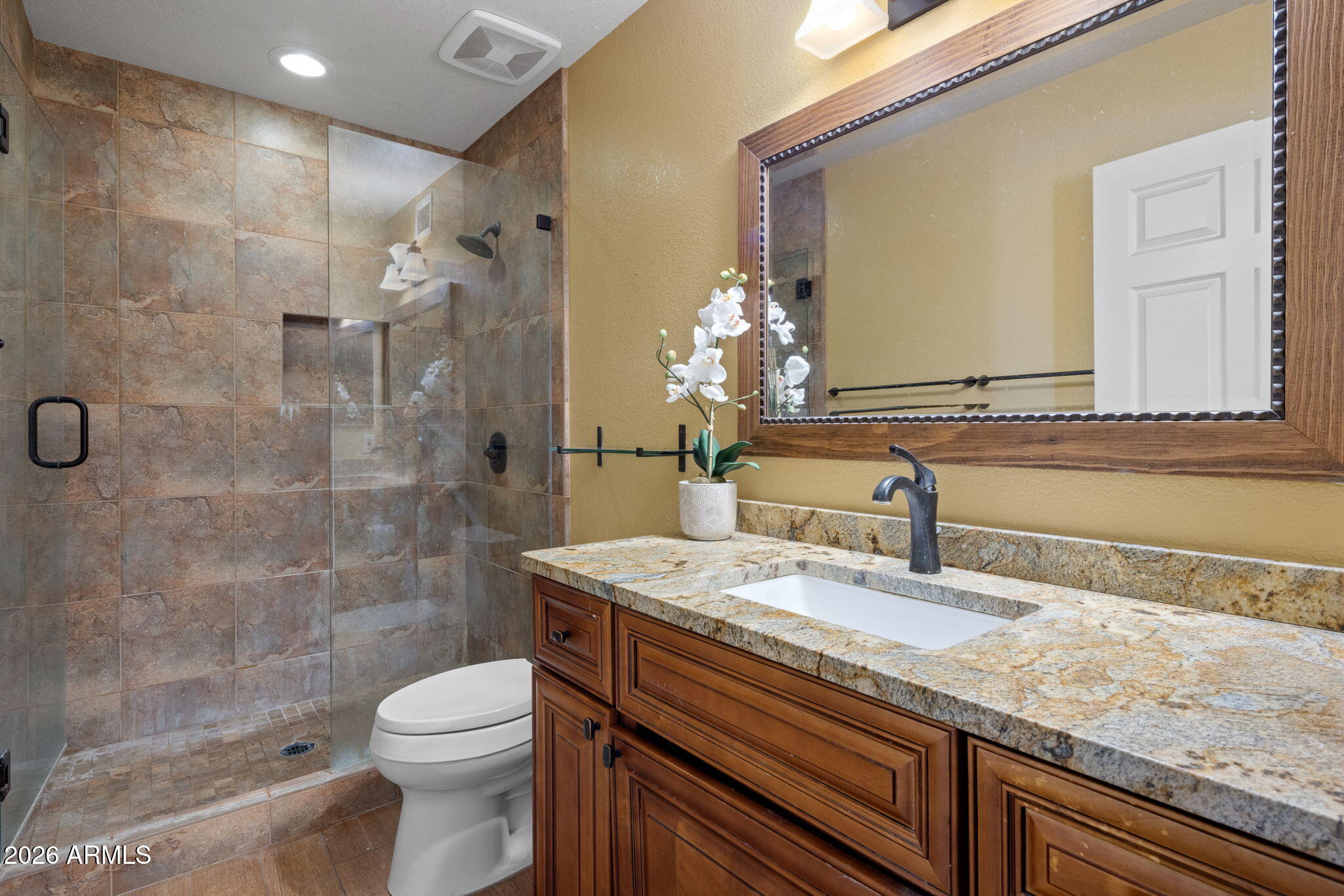 542 South Higley Road, Unit 54 Mesa, AZ 85206 - Photo 15 of 29 a bathroom with a granite countertop sink a toilet and shower