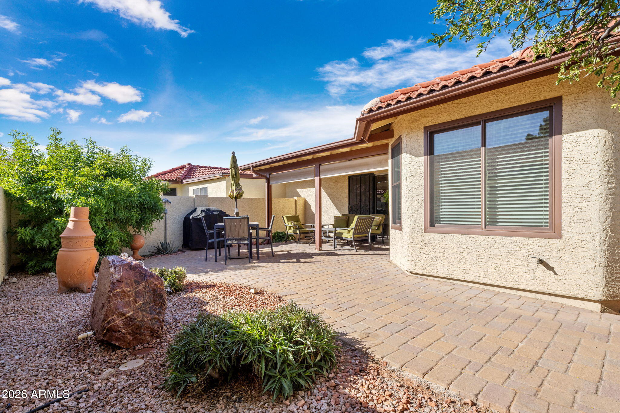 542 South Higley Road, Unit 54 Mesa, AZ 85206 - Photo 18 of 29 a view of a house with backyard porch and sitting area