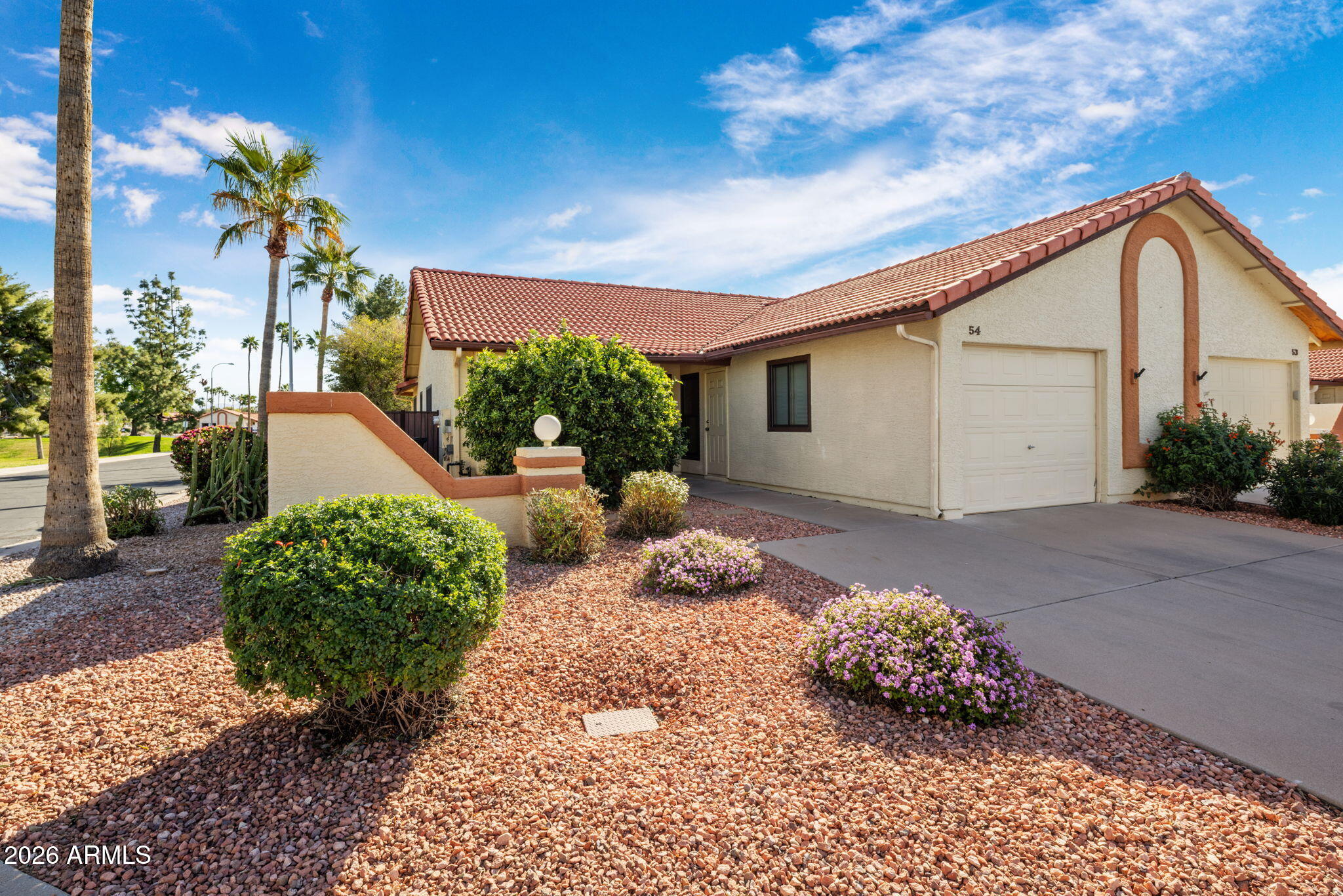 542 South Higley Road, Unit 54 Mesa, AZ 85206 - Photo 2 of 29 a front view of a house with a yard
