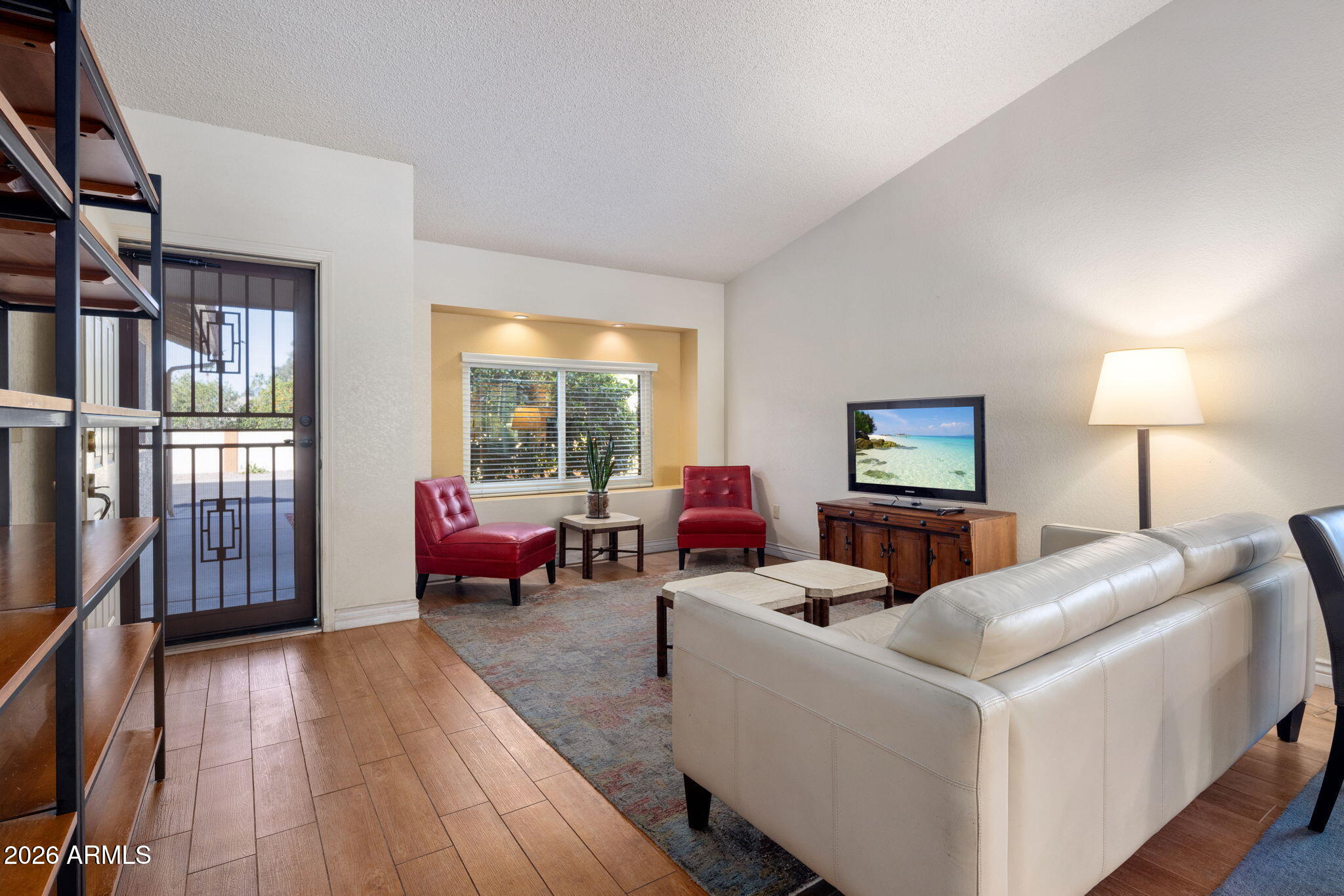 542 South Higley Road, Unit 54 Mesa, AZ 85206 - Photo 3 of 29 a living room with furniture and a wooden floor