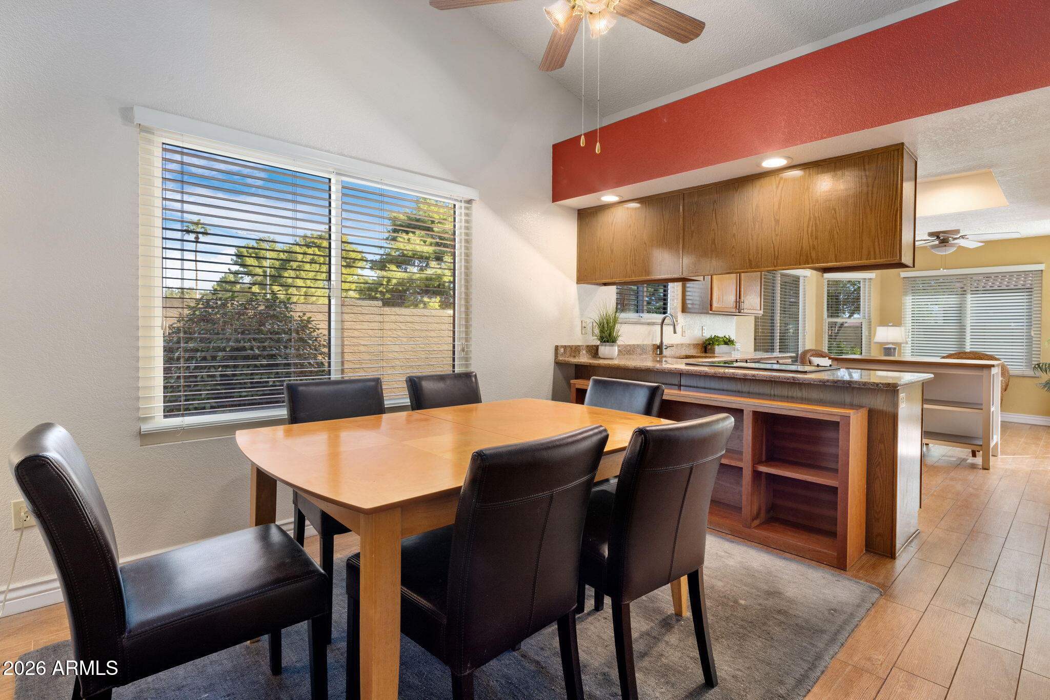 542 South Higley Road, Unit 54 Mesa, AZ 85206 - Photo 5 of 29 a view of a dining room with furniture window and wooden floor