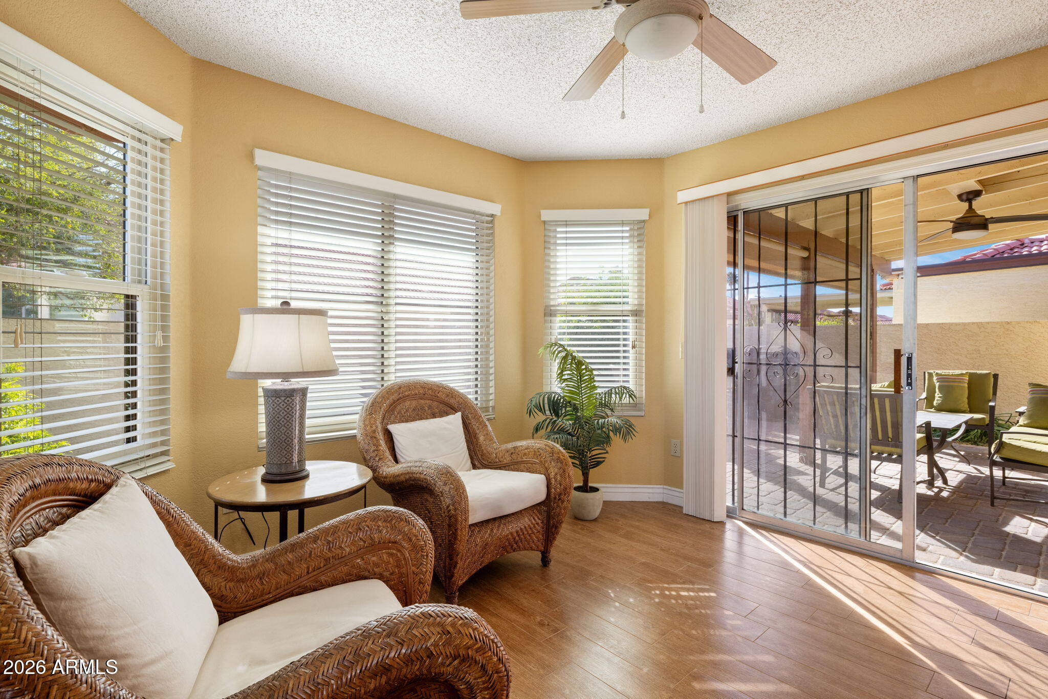 542 South Higley Road, Unit 54 Mesa, AZ 85206 - Photo 10 of 29 a living room with furniture and a floor to ceiling window