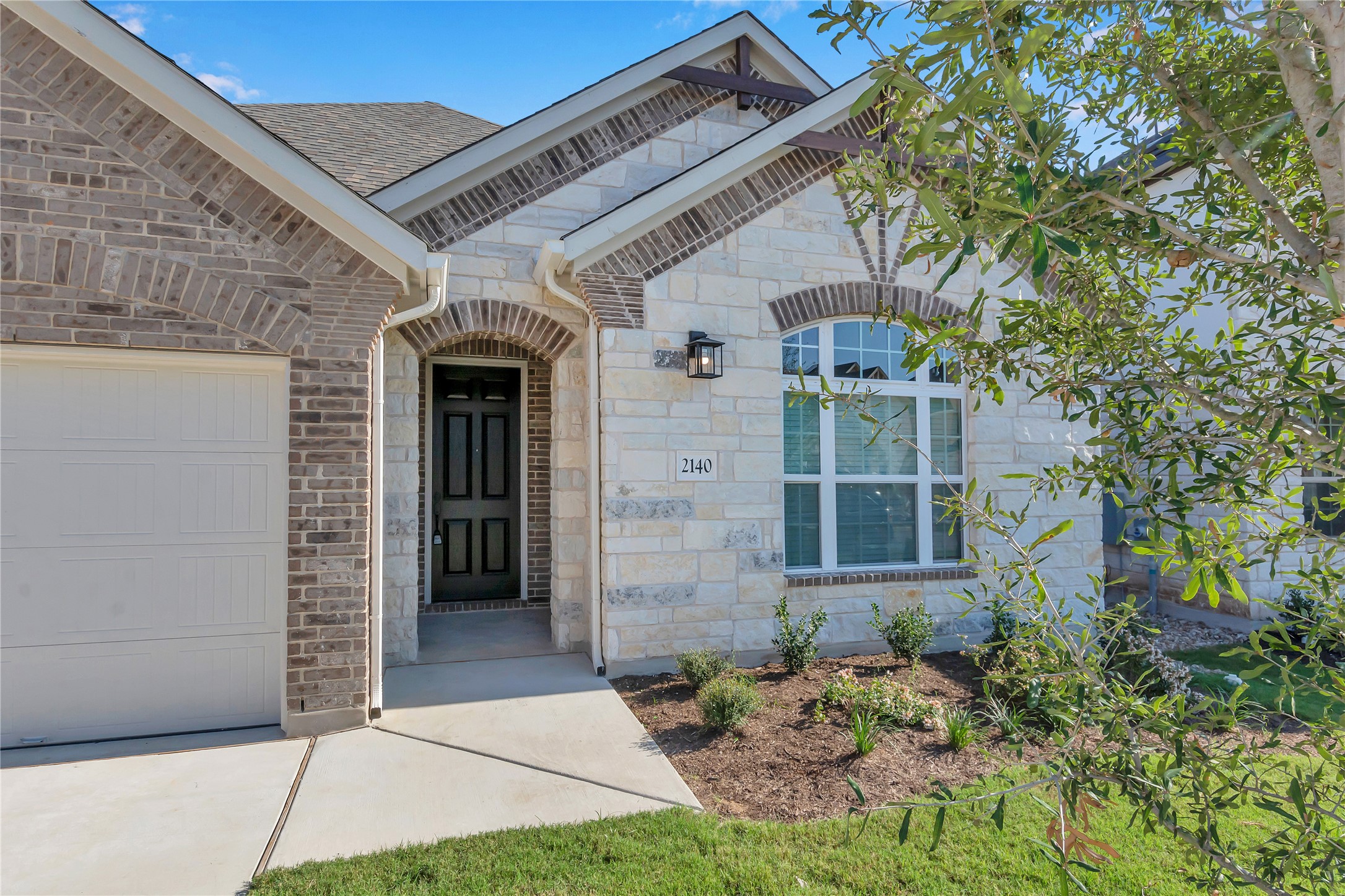 2140 Base Burner Path Leander, TX 78641 - Photo 3 of 27 a front view of a house with garden