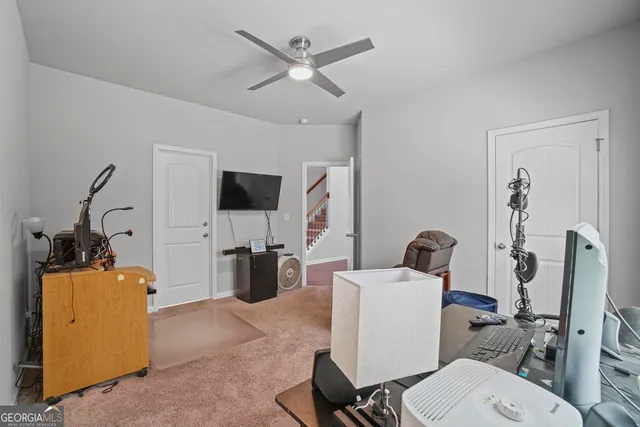 a bathroom with a toilet mirror and tub