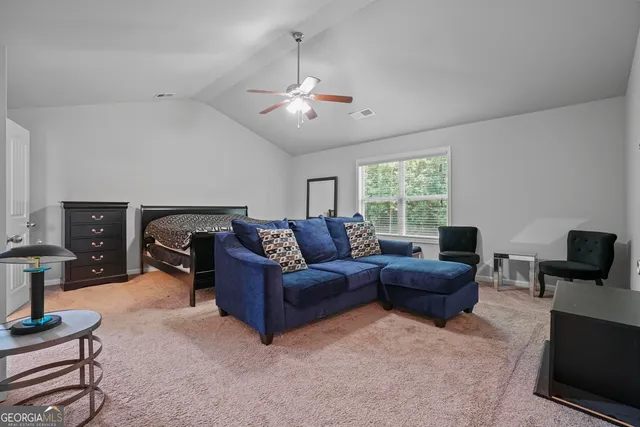 a living room with furniture a lamp and a fireplace
