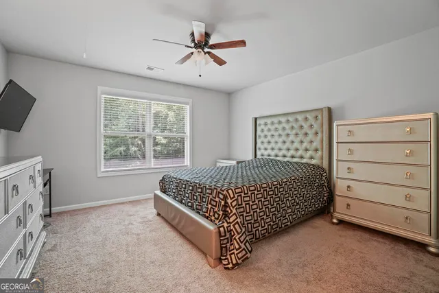 a bed room with a bed and a window