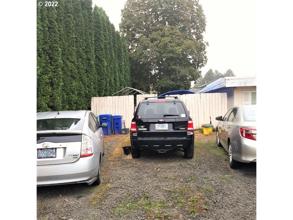 1223 Southeast Barnes Road Gresham, OR 97080 - Photo 3 of 12 a car parked in front of a house