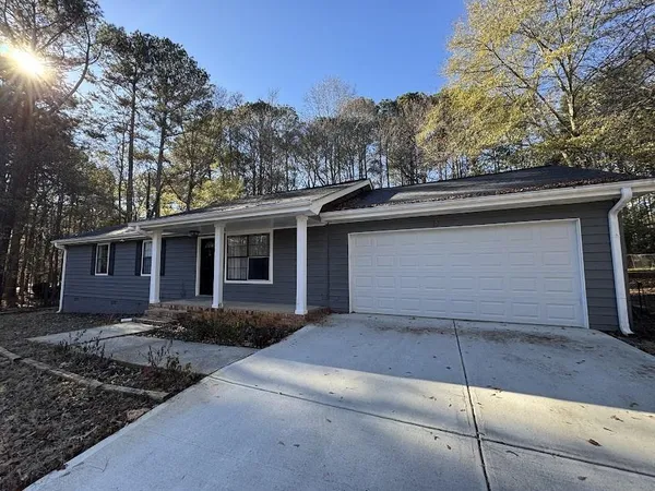 a front view of a house with yard