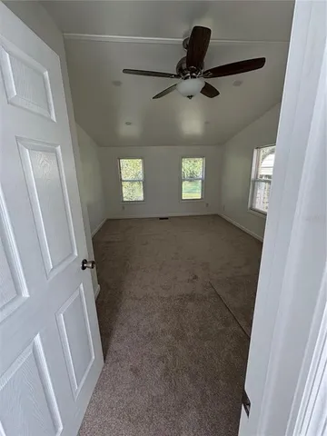 a backyard of a house with lots of green space