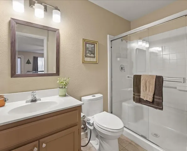 a spacious bathroom with a double vanity sink and a mirror