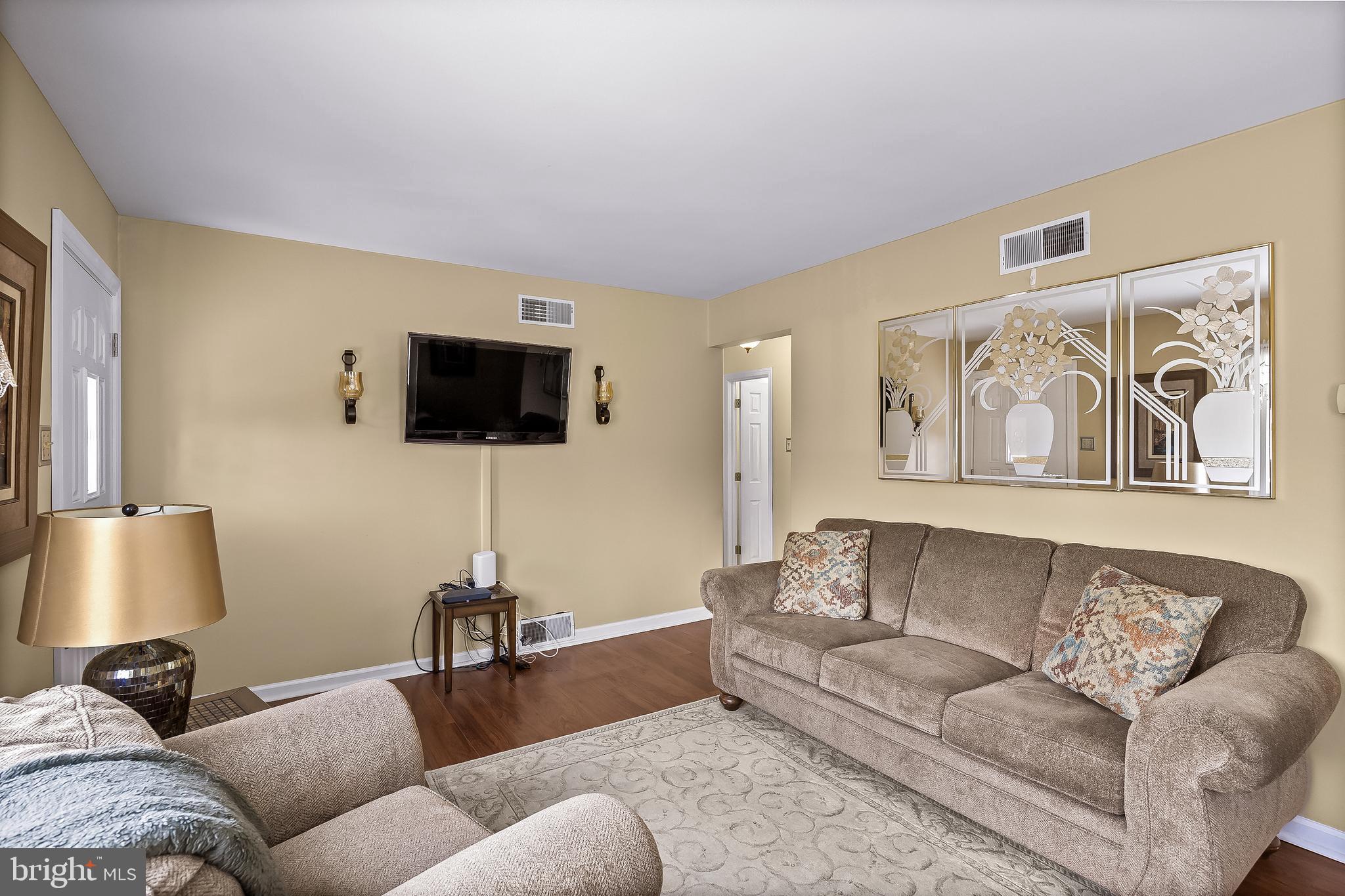 74 North Chester Avenue Riverside, NJ 08075 - Photo 6 of 26 a living room with furniture and a flat screen tv