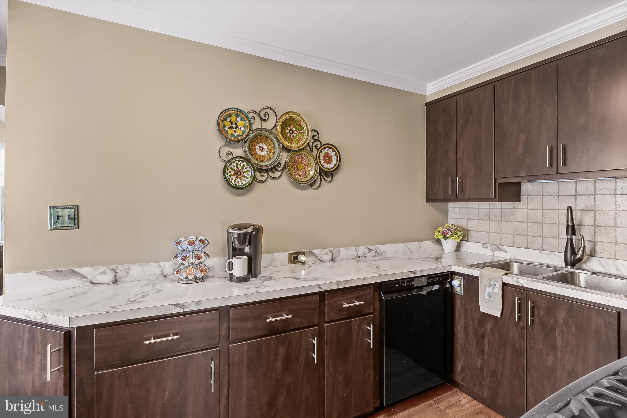 74 North Chester Avenue Riverside, NJ 08075 - Photo 9 of 26 a kitchen with a sink a stove and cabinets