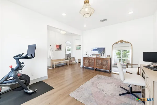 a kitchen with stainless steel appliances a refrigerator and cabinets