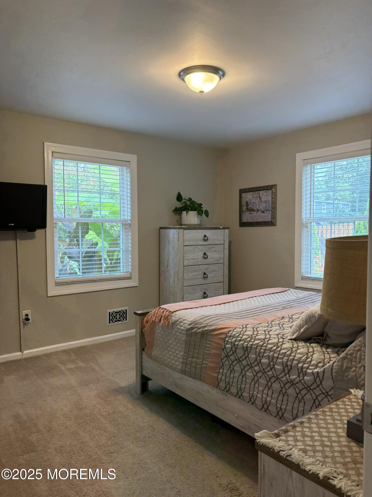 650 Chelsea Street Forked River, NJ 08731 - Photo 20 of 82 a bedroom with a bed and a window