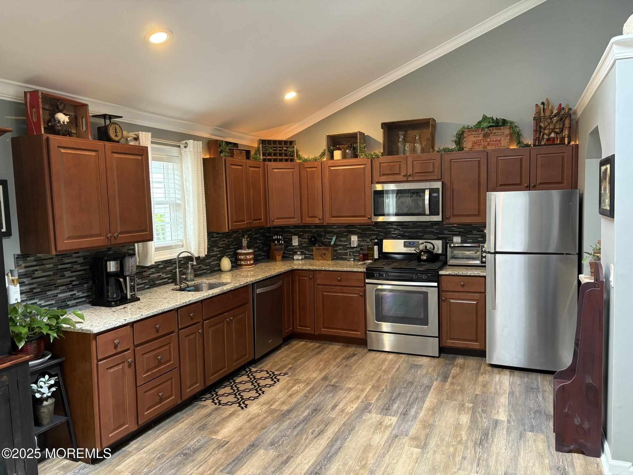 650 Chelsea Street Forked River, NJ 08731 - Photo 27 of 82 a kitchen with stainless steel appliances granite countertop a refrigerator stove and sink
