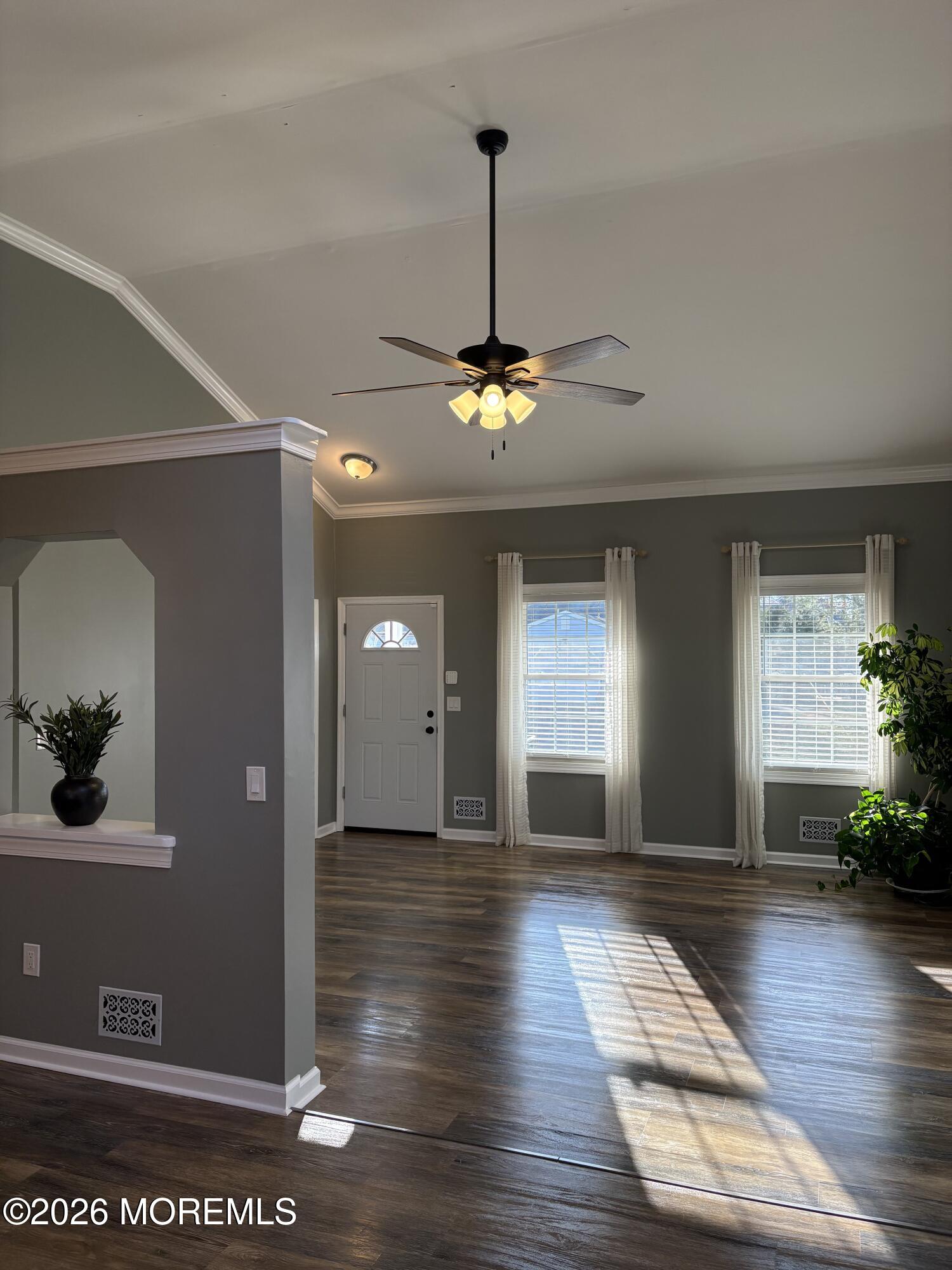 650 Chelsea Street Forked River, NJ 08731 - Photo 30 of 82 a view of a hallway with wooden floor and a chandelier