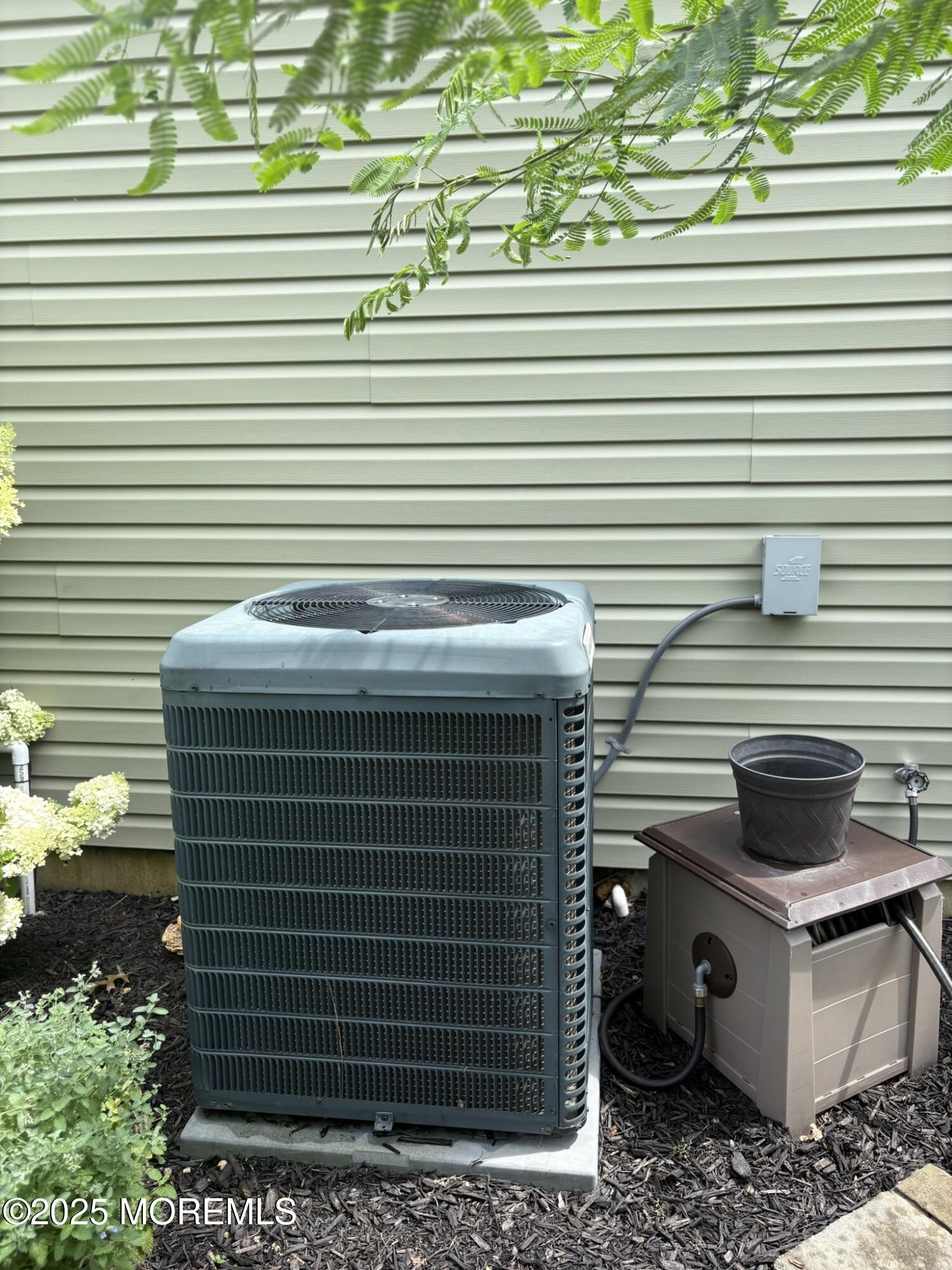 650 Chelsea Street Forked River, NJ 08731 - Photo 34 of 82 a view of a patio with a table and chairs and a potted plant