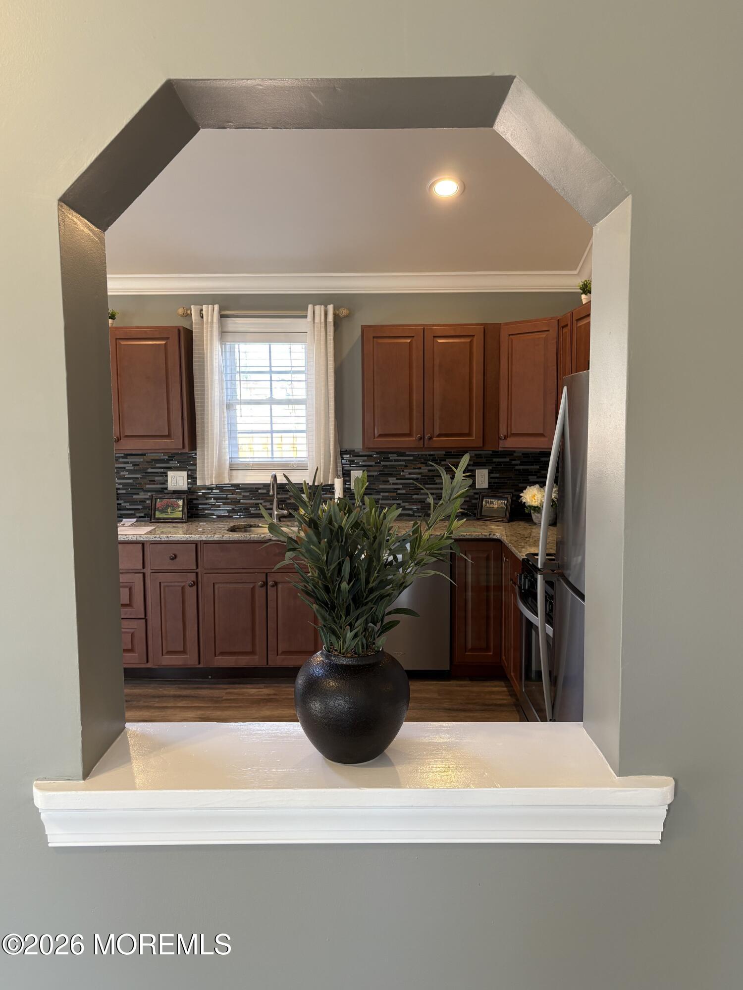650 Chelsea Street Forked River, NJ 08731 - Photo 53 of 82 a kitchen with a sink a stove and refrigerator