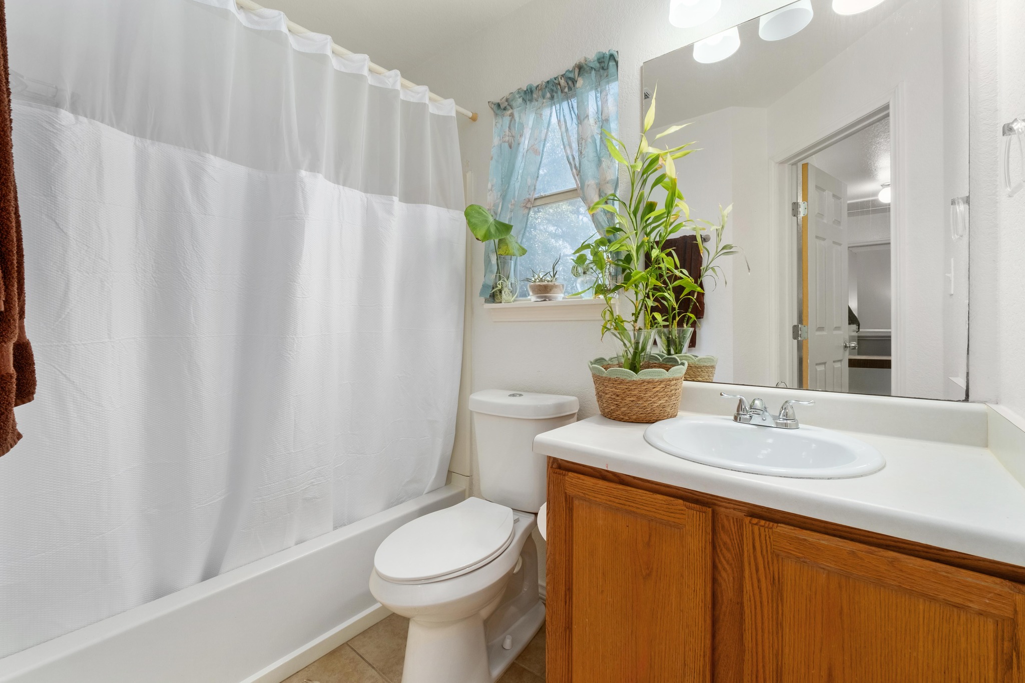 1184 Waller Street Austin, TX 78702 - Photo 13 of 19 a bathroom with a sink a toilet and shower