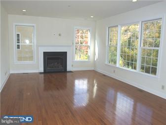 236 North Highland Road Springfield, PA 19064 - Photo 8 of 12 a view of empty room with wooden floor and fireplace