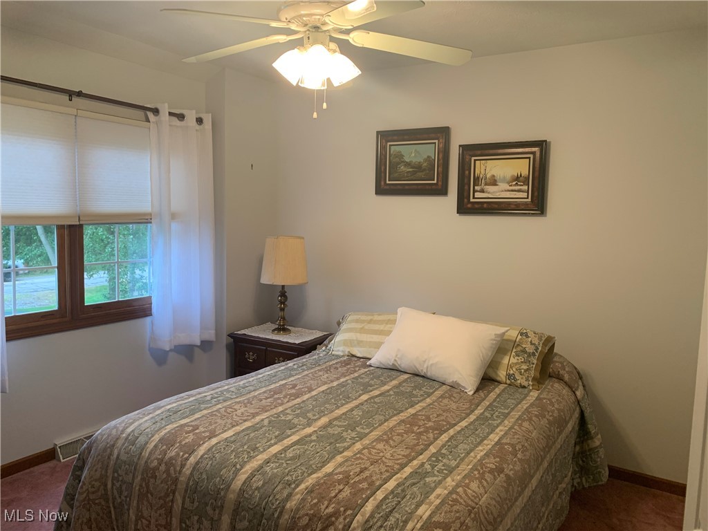 9046 Shepard Road Macedonia, OH 44056 - Photo 24 of 33 Second Bedroom with lighted ceiling fan and carpet