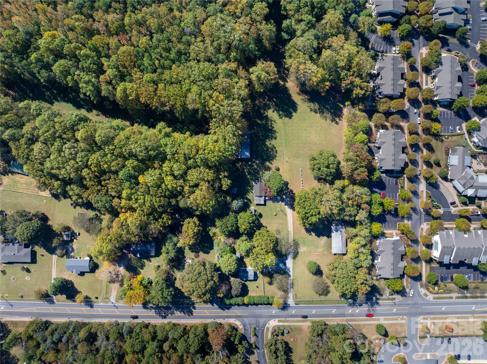 9009 Reames Road Charlotte, NC 28216 - Photo 5 of 6 a view of a lake with a tree