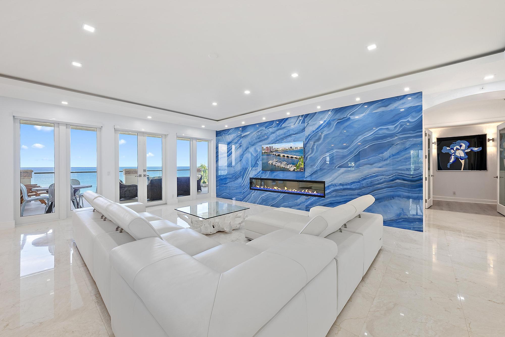 2070 North Ocean Boulevard, Unit PH4 Boca Raton, FL 33431 - Photo 5 of 46 a living room with furniture and a fireplace