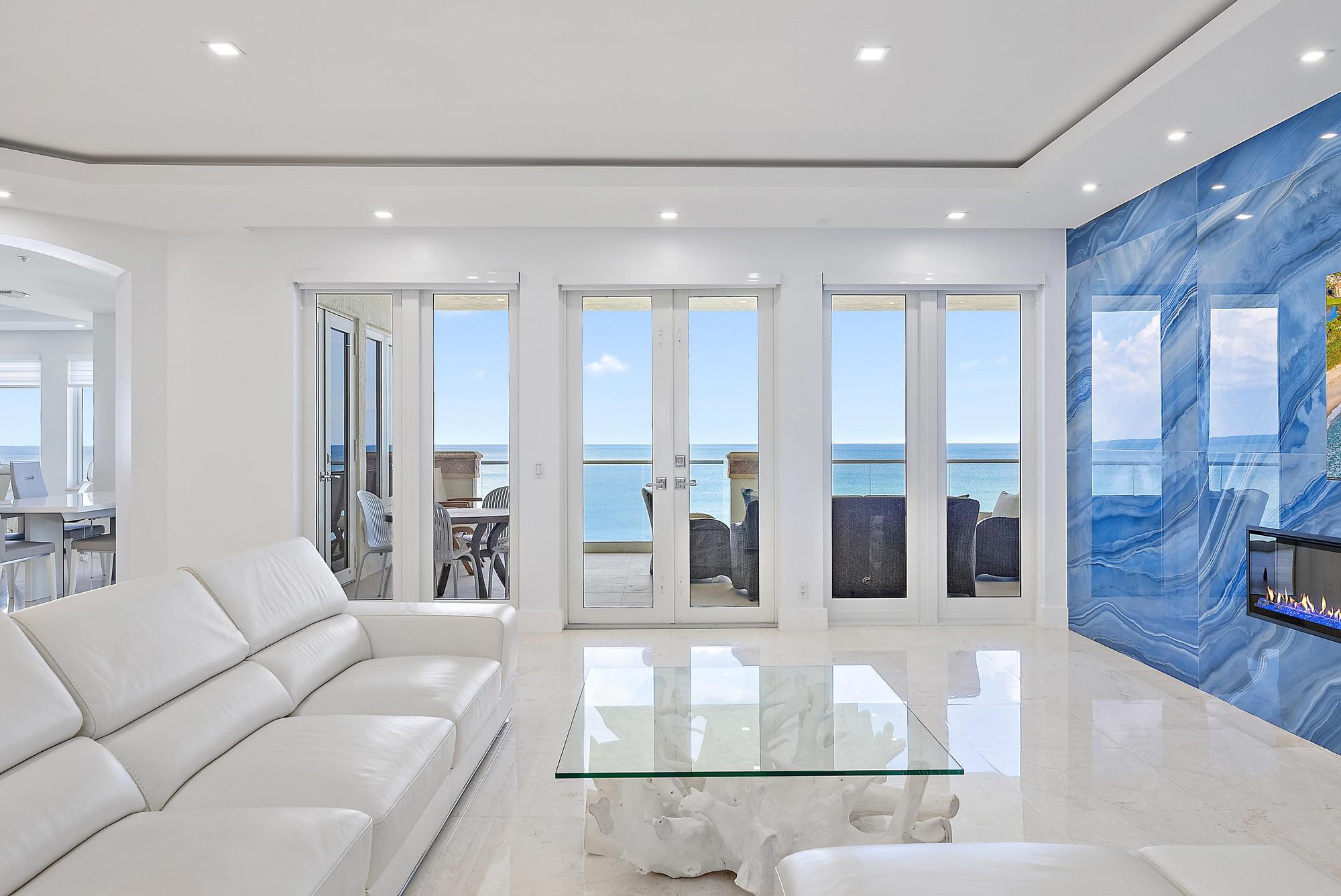 2070 North Ocean Boulevard, Unit PH4 Boca Raton, FL 33431 - Photo 10 of 46 a living room with furniture and a large window