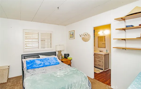 a bed room with a bed and a window