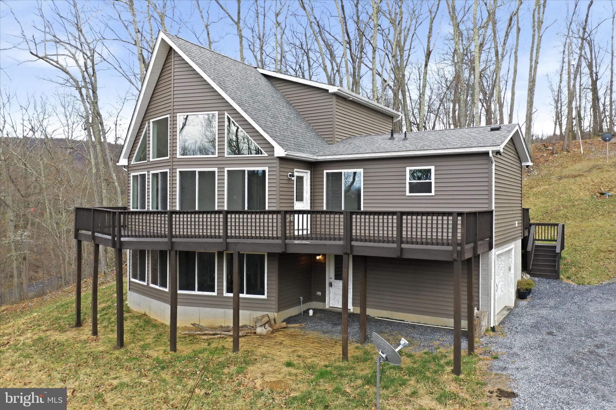490 Black Twig Road Linden, VA 22642 - Photo 2 of 44 a front view of a house with balcony