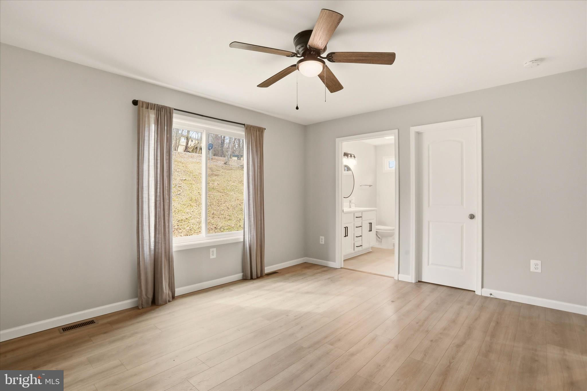 490 Black Twig Road Linden, VA 22642 - Photo 22 of 44 a view of an empty room with a window