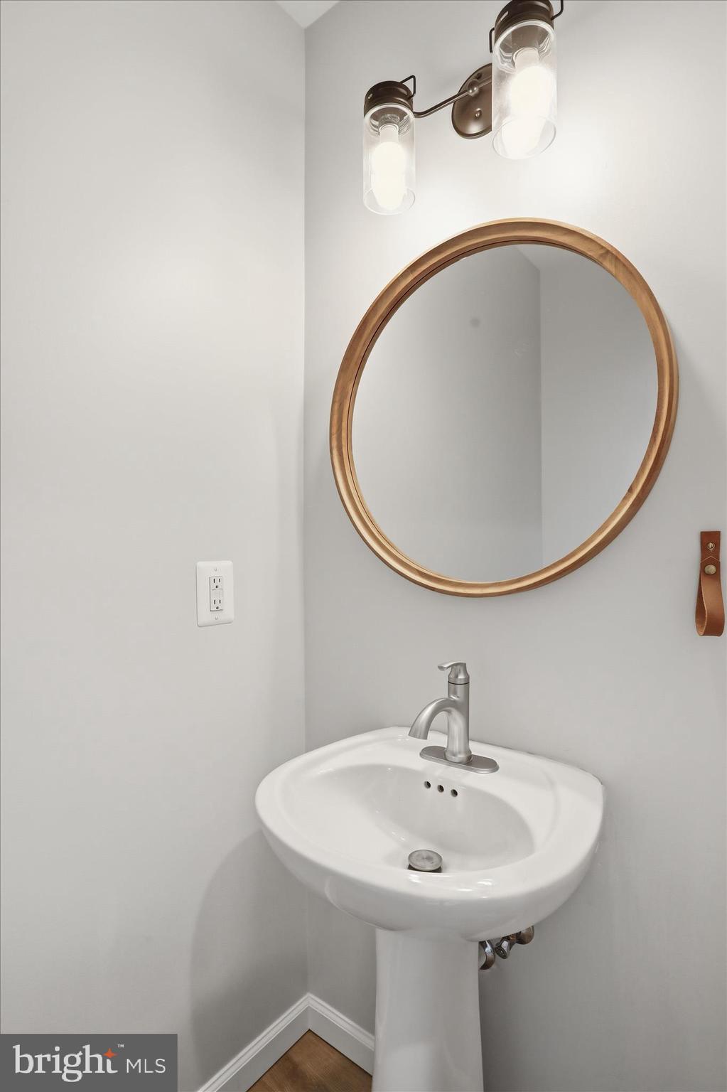 490 Black Twig Road Linden, VA 22642 - Photo 30 of 44 a bathroom with a sink and a mirror