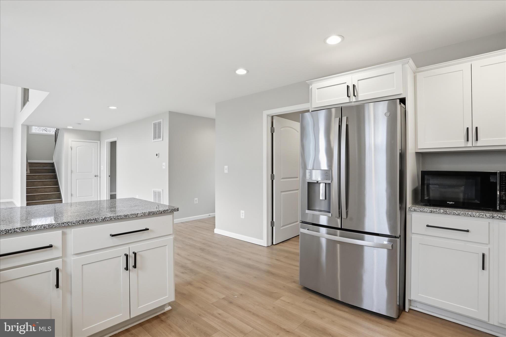 490 Black Twig Road Linden, VA 22642 - Photo 3 of 44 a kitchen with stainless steel appliances a refrigerator and a stove top oven